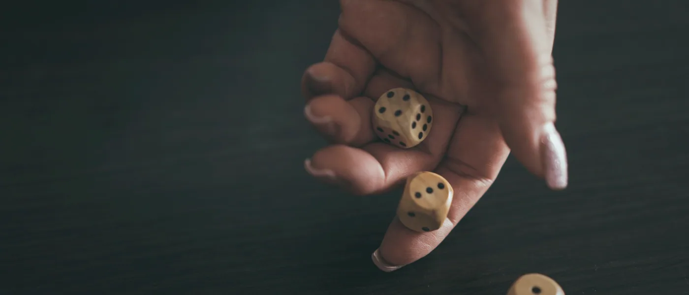 A handful of chips set beside a folded scoresheet